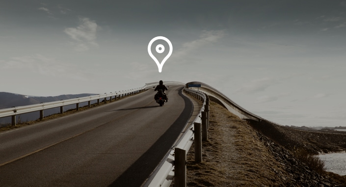 man on motorcycle with location icon overhead